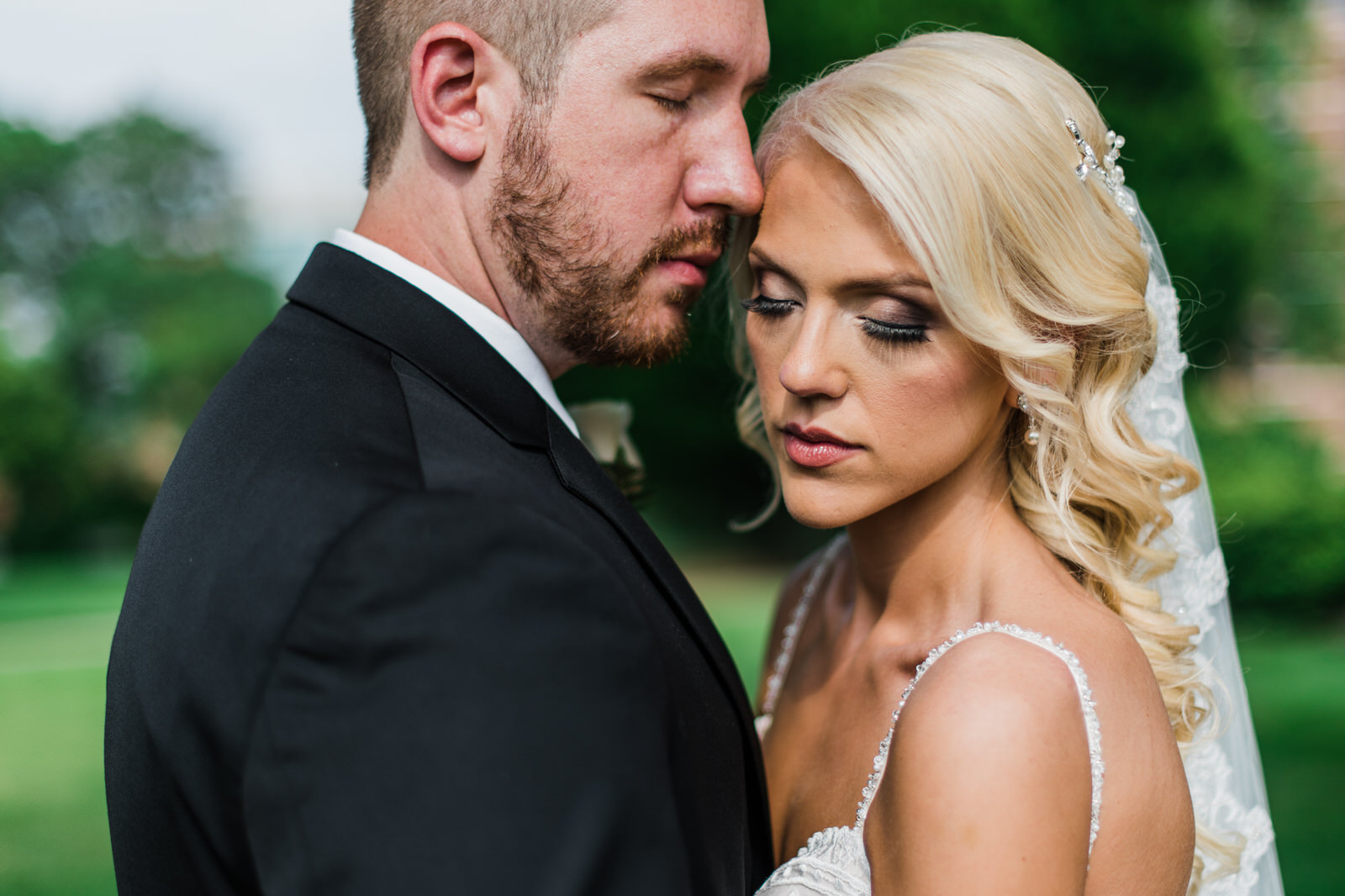 bride and groom closed eyes