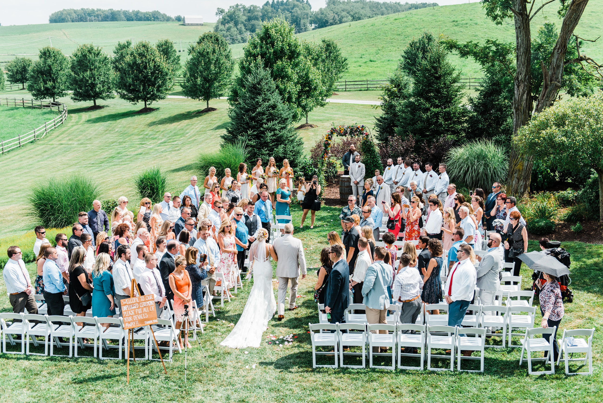 bride walks down aisle at Armstrong Farms Wedding Venue