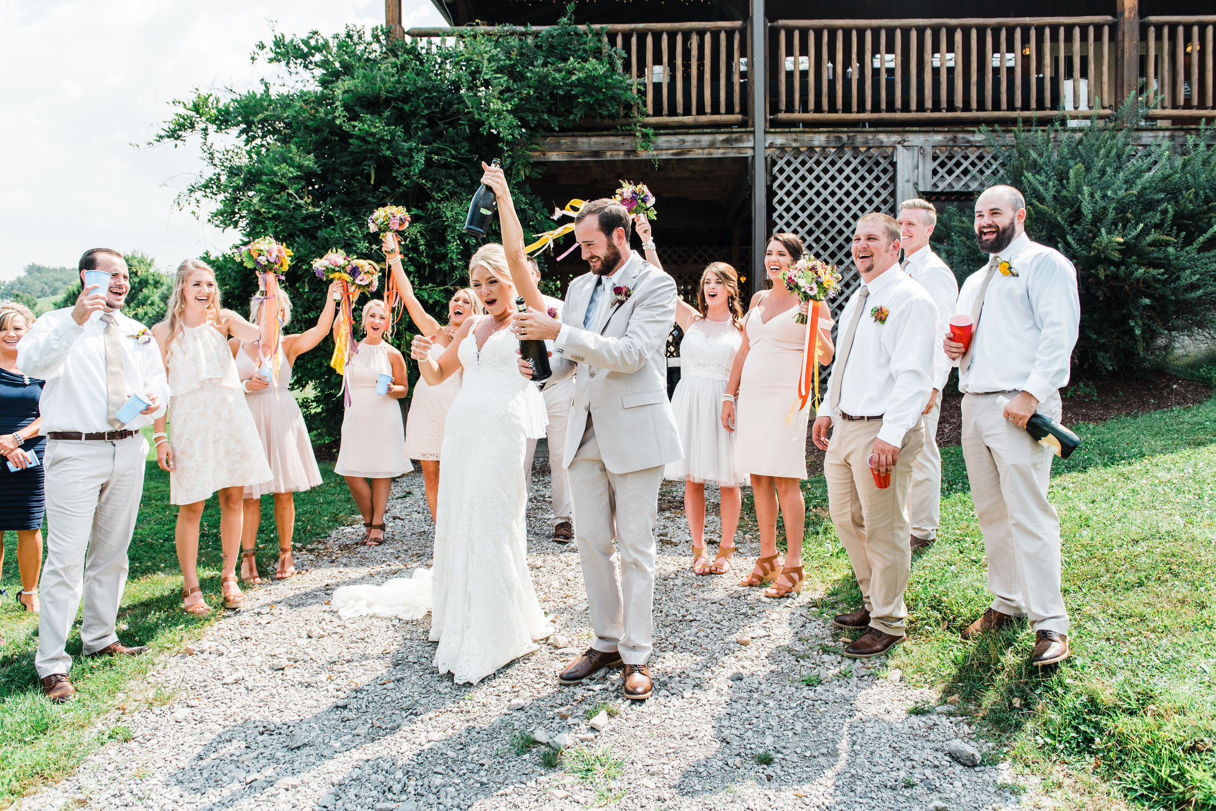 bride and groom celebrate at Armstrong Farms Wedding Venue